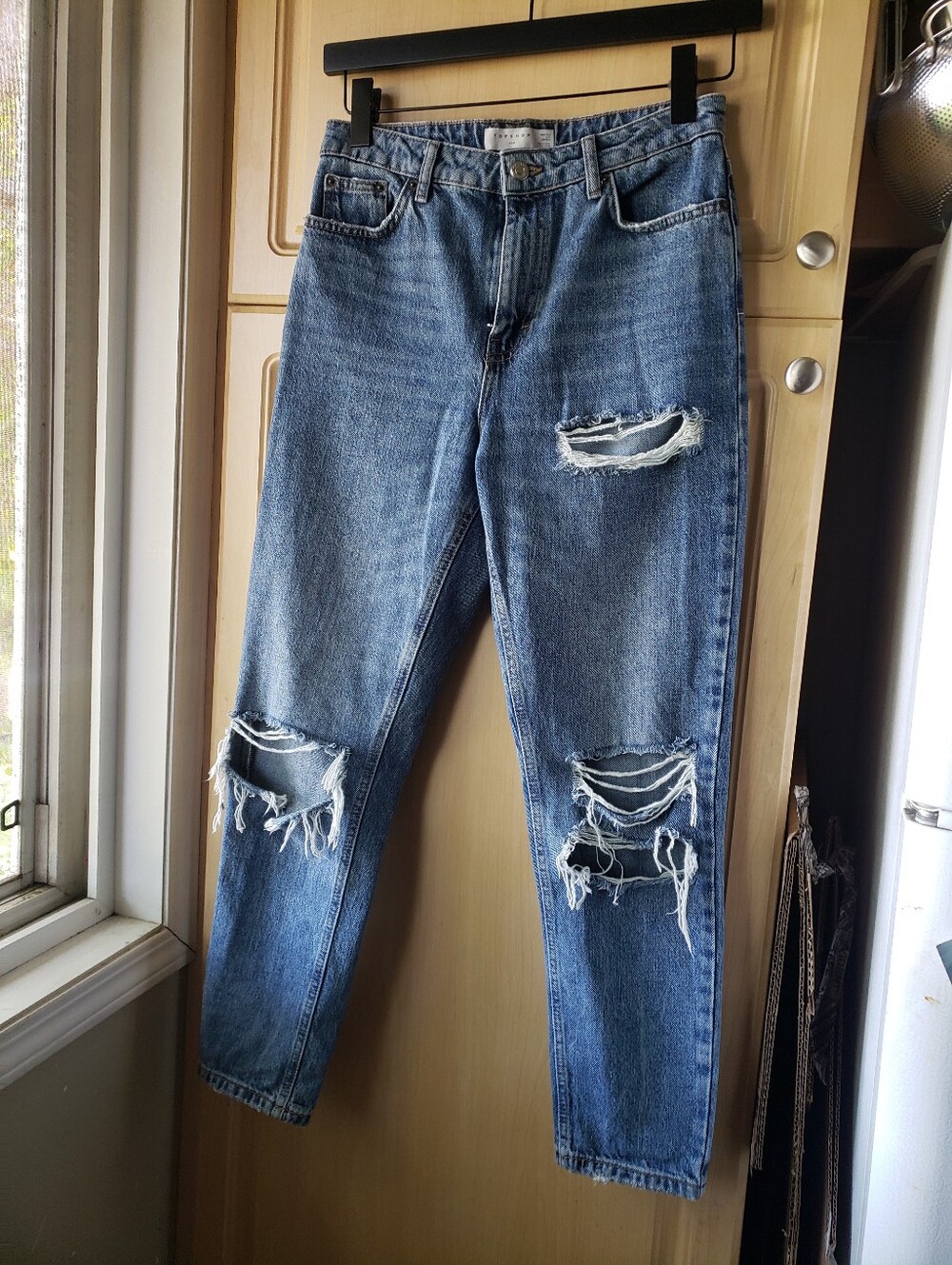 Topshop Mom Distressed Jeans in light blue denim